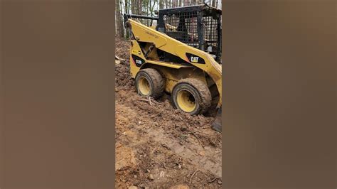 how to get skid steer out of mud|skid steer stuck in dirt.